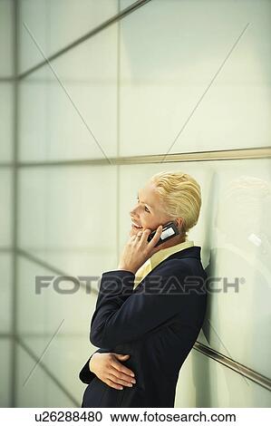 Businesswoman Using Cell Phone, side view View Large Photo Image Stock Image - Businesswoman Using Cell Phone, side view. Fotosearch