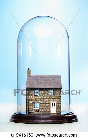 Stock Image - Ceramic house under glass cover. Fotosearch