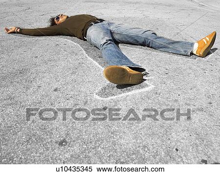 Stock Photography - Chalk outline around dead victim lying in street. Fotosearch