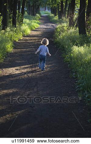 Child on country path View Large Photo Image Stock Photo - Child on country path. Fotosearch