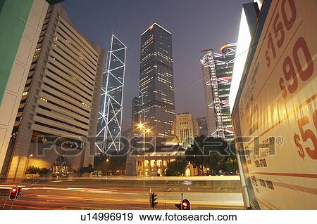 China, Hong Kong, illuminated skyscrapers and blurred traffic View Large Photo Image Stock Photo - China, Hong Kong, illuminated skyscrapers and blurred traffic. Fotosearch