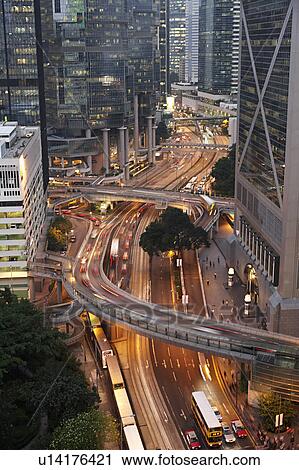 Stock Image - China, Hong Kong, office buildings and street, elevated view. Fotosearch
