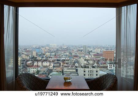 Stock Photo - City Seen Through Open Hotel Window. Fotosearch