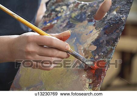 Close-up of woman's hand with brush and palette View Large Photo Image Stock Photo - Close-up of woman's hand with brush and palette. Fotosearch