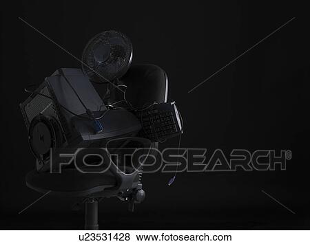 Computer equipment and fan on office chair View Large Photo Image Stock Photo - Computer equipment and fan on office chair . Fotosearch