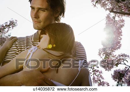 Stock Image - Couple Hugging. Fotosearch