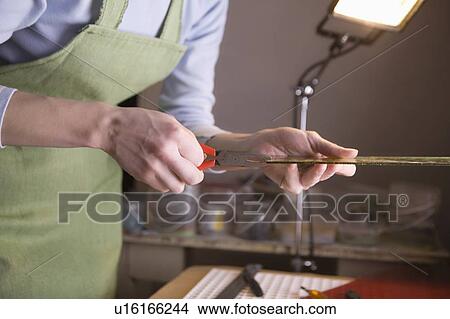 Craftswoman cuts glass View Large Photo Image Picture - Craftswoman cuts glass. Fotosearch