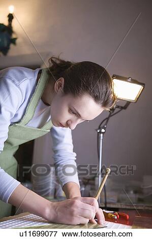 Craftswoman marking glass View Large Photo Image Stock Photo - Craftswoman marking glass. Fotosearch