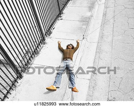 Dead victim lying on pavement, elevated view View Large Photo Image Stock Image - Dead victim lying on pavement, elevated view. Fotosearch