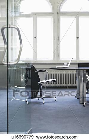 Empty conference room with laptop on table View Large Photo Image Stock Photo - Empty conference room with laptop on table. Fotosearch