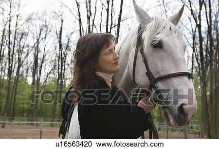 Equestrian With Her Horse View Large Photo Image Stock Image - Equestrian With Her Horse. Fotosearch