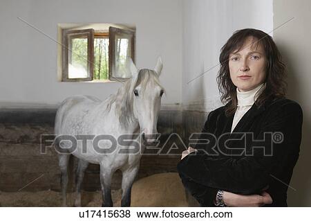 Equestrian With Her Horse View Large Photo Image Stock Photo - Equestrian With Her Horse. Fotosearch