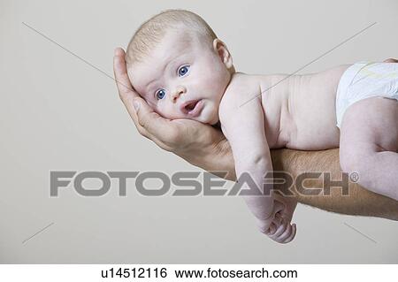 Father holding baby boy View Large Photo Image Stock Photograph - Father holding baby boy. Fotosearch