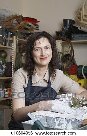 Female artist working in studio, portrait View Large Photo Image Stock Photograph - Female artist working in studio, portrait. Fotosearch
