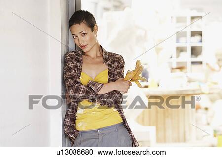 Female interior decorator by tool room, portrait View Large Photo Image Stock Image - Female interior decorator by tool room, portrait. Fotosearch