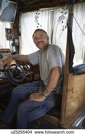 Fisherman in Cabin of Fishing Boat View Large Photo Image Picture - Fisherman in Cabin of Fishing Boat. Fotosearch