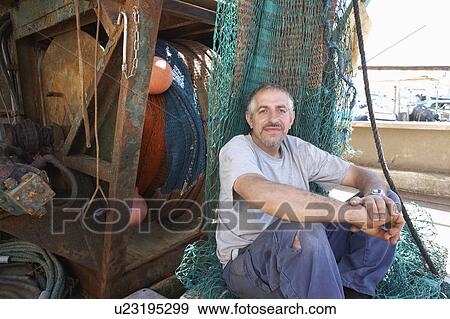 Fisherman on Boat by Fishing Net View Large Photo Image Stock Photo - Fisherman on Boat by Fishing Net. Fotosearch