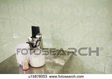 Stock Image - Flatware and Bowls on Table in Cafe. Fotosearch