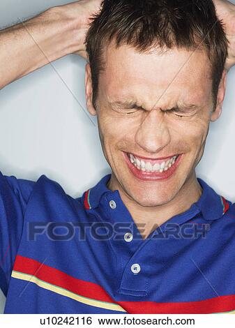 Frustrated man in studio, head and shoulders View Large Photo Image Stock Photograph - Frustrated man in studio, head and shoulders. Fotosearch
