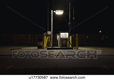 Stock Photo - Fuel pump illuminated at night. Fotosearch