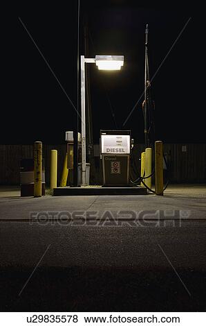 Fuel pump illuminated at night View Large Photo Image Stock Photo - Fuel pump illuminated at night. Fotosearch