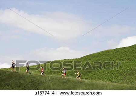 Group jogging up hillside View Large Photo Image Stock Image - Group jogging up hillside. Fotosearch