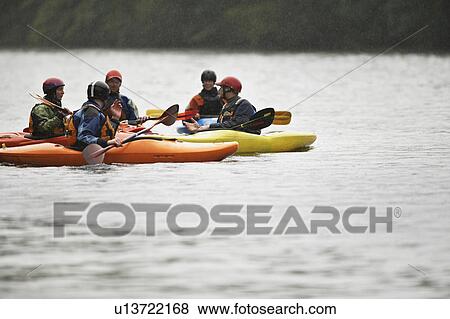Group kayaking in river View Large Photo Image Stock Photo - Group kayaking in river. Fotosearch