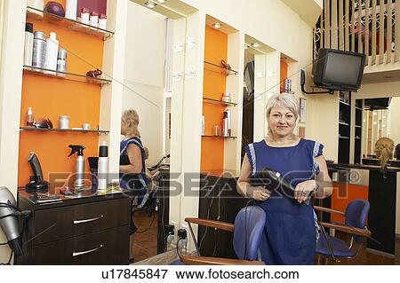 Hairstylist in Beauty Salon View Large Photo Image Stock Photo - Hairstylist in Beauty Salon. Fotosearch