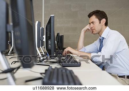 Stock Photo - High School Teacher in Computer Lab. Fotosearch
