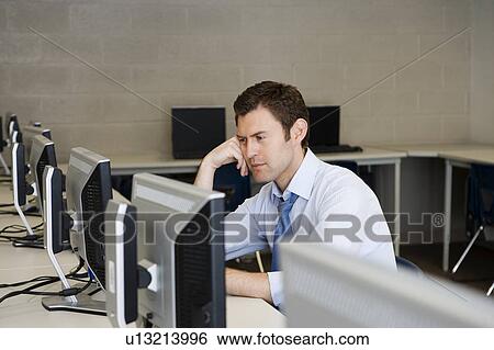 Stock Photograph - High School Teacher in Computer Lab. Fotosearch