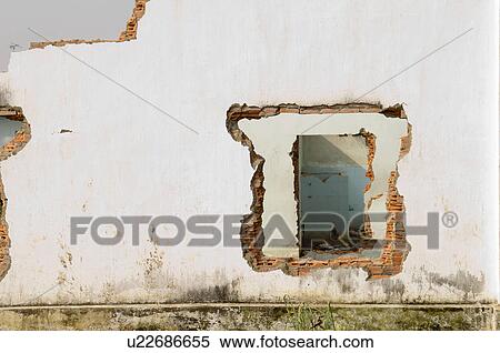 Stock Photography - Hole in Ruined Brick Building. Fotosearch