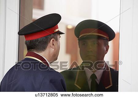 Hotel Doorman Reflected in Glass Door View Large Photo Image Stock Photography - Hotel Doorman Reflected in Glass Door. Fotosearch