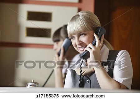 Hotel Receptionists on Telephone View Large Photo Image Stock Photography - Hotel Receptionists on Telephone. Fotosearch