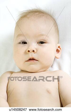 Stock Photo - Infant child lying on back. Fotosearch