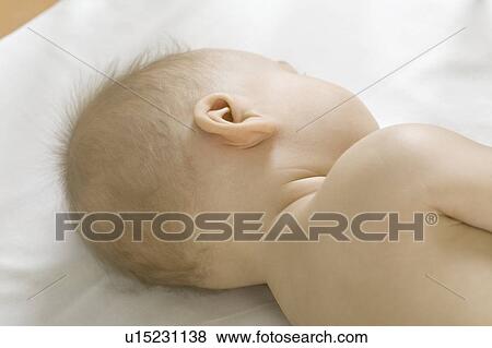 Infant child lyng on side View Large Photo Image Stock Photo - Infant child lyng on side. Fotosearch