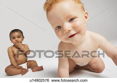 Stock Photograph - Introvert and Extrovert Babies. Fotosearch