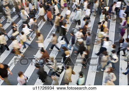 Picture - Japan, Osaka, People crossing street, view from above, motion blur. Fotosearch