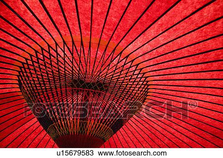 Stock Image - Japan, Tokyo, traditional red umbrella, close-up. Fotosearch