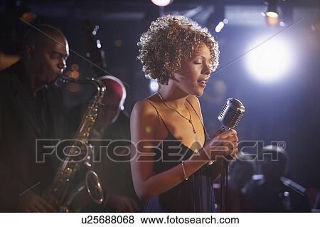 Stock Photo - Jazz band on stage, group portrait. Fotosearch