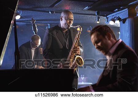 Jazz band on stage, group portrait View Large Photo Image Stock Photograph - Jazz band on stage, group portrait. Fotosearch
