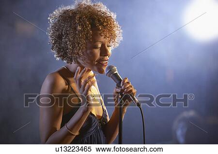 Jazz singer on stage, portrait View Large Photo Image Stock Photography - Jazz singer on stage, portrait. Fotosearch