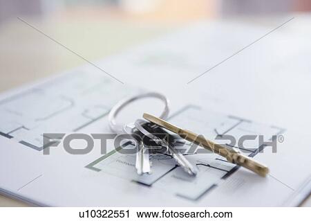 Key ring with three keys lying on architectural blueprints, close-up View Large Photo Image Stock Image - Key ring with three keys lying on architectural blueprints, close-up. Fotosearch