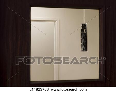 Stock Photograph - Keyboard hanging from ceiling. Fotosearch
