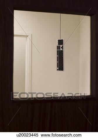 Stock Photography - Keyboard hanging from ceiling. Fotosearch
