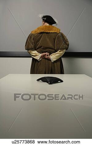 King Henry VIII standing behind table in conference room View Large Photo Image Stock Photo - King Henry VIII standing behind table in conference room. Fotosearch