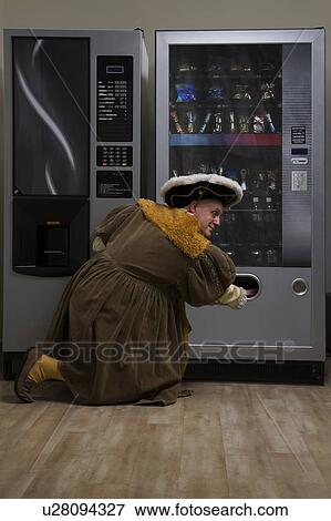 King Henry VIII using vending machine in cafe View Large Photo Image Stock Photo - King Henry VIII using vending machine in cafe. Fotosearch