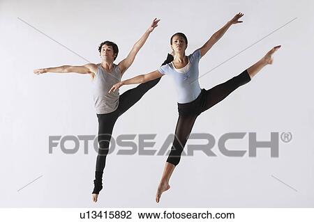 Leaping Ballet Dancers in Mid-air View Large Photo Image Stock Image - Leaping Ballet Dancers in Mid-air. Fotosearch