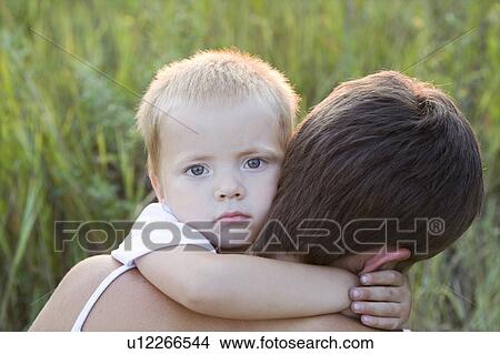 Picture - Little Boy Hugging His Mother. Fotosearch