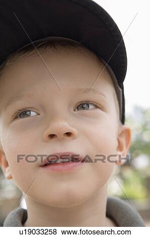 Stock Photo - Little Boy in Baseball Cap. Fotosearch