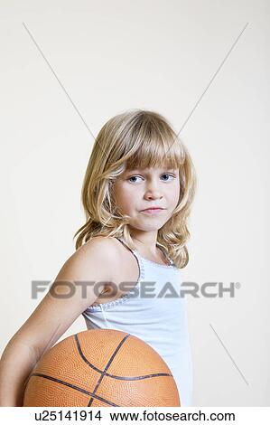 Picture - Little Girl Holding Basketball. Fotosearch
